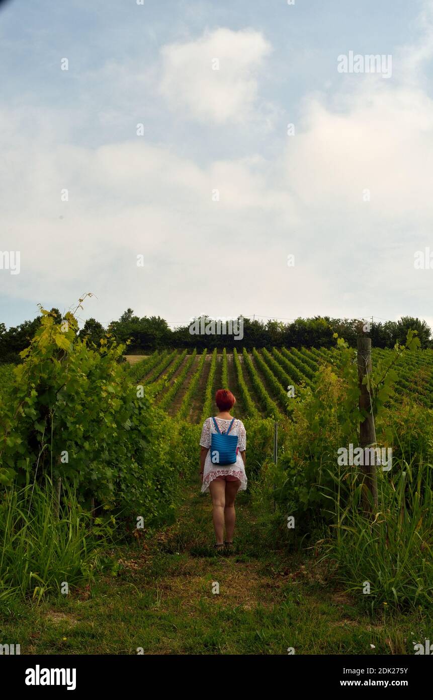 Full Length Of Woman Standing In Farm Against Sky Stock Photo