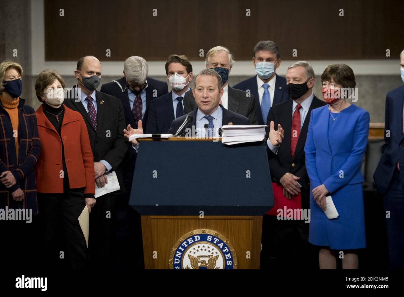 United States Representative Joshua Gottheimer (Democrat of New Jersey) offers remarks as he joins United States Senator Joe Manchin III (Democrat of West Virginia) and a bipartisan group of US Senators announcing the legislative text of the two bipartisan, bicameral COVID-19 emergency relief bills that propose to provide up to $908 billion in emergency relief in the Dirksen Senate Office Building on Capitol Hill in Washington, DC, USA on Monday, December 14, 2020. United States Senator Bill Cassidy (Republican of Louisiana) holds up one of the two bills as he joins United States Senator Joe M Stock Photo