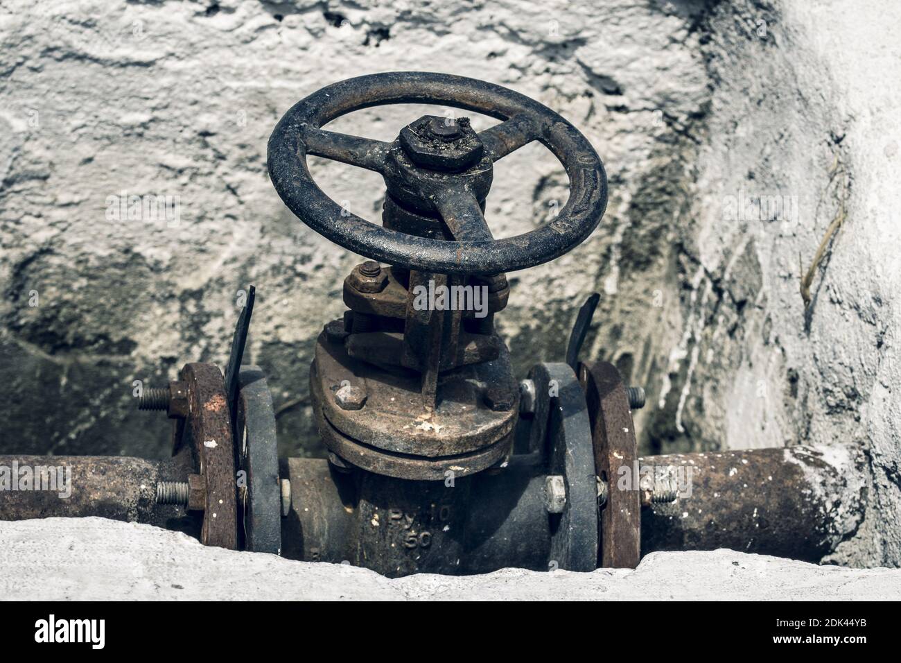 Large old rusted pipe valve. Close up Stock Photo