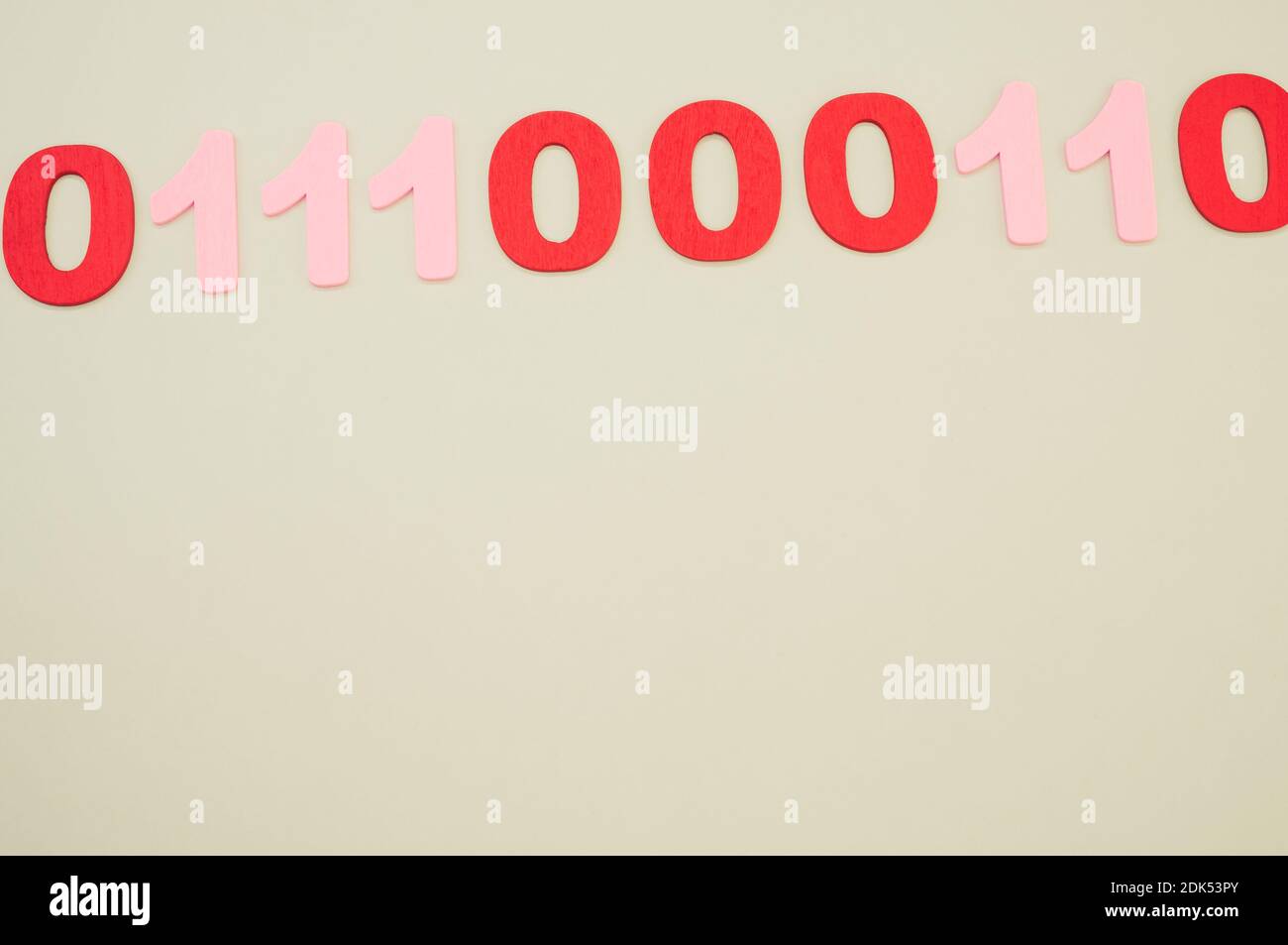 A top view of red and pink binary codes on a white surface Stock Photo ...