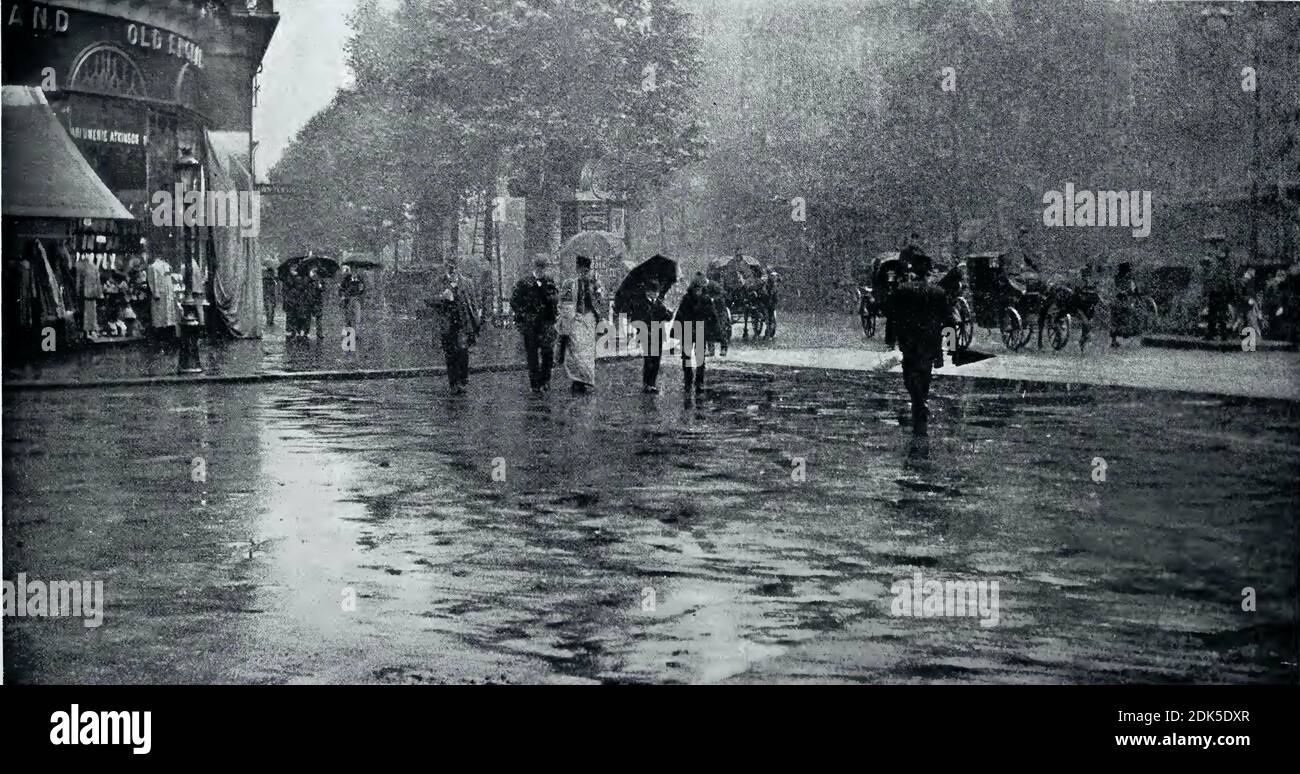 Wet Day on the Boulevard by Alfred Stieglitz. The photograph depicts the intersection of Boulevard des Italiens and rue Scribe in Paris, France. Stock Photo