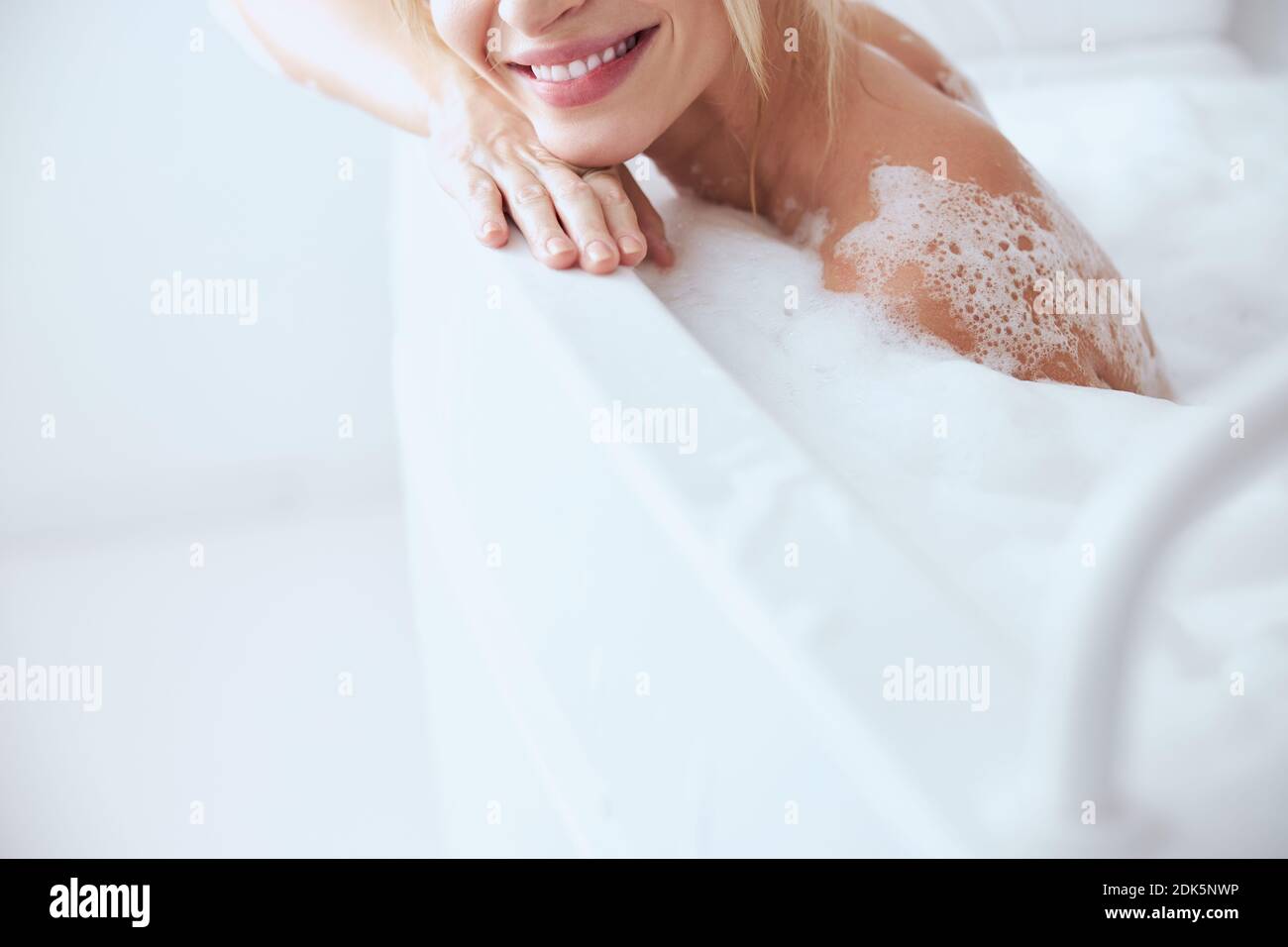 Young blonde woman in bathtub hi-res stock photography and images - Alamy