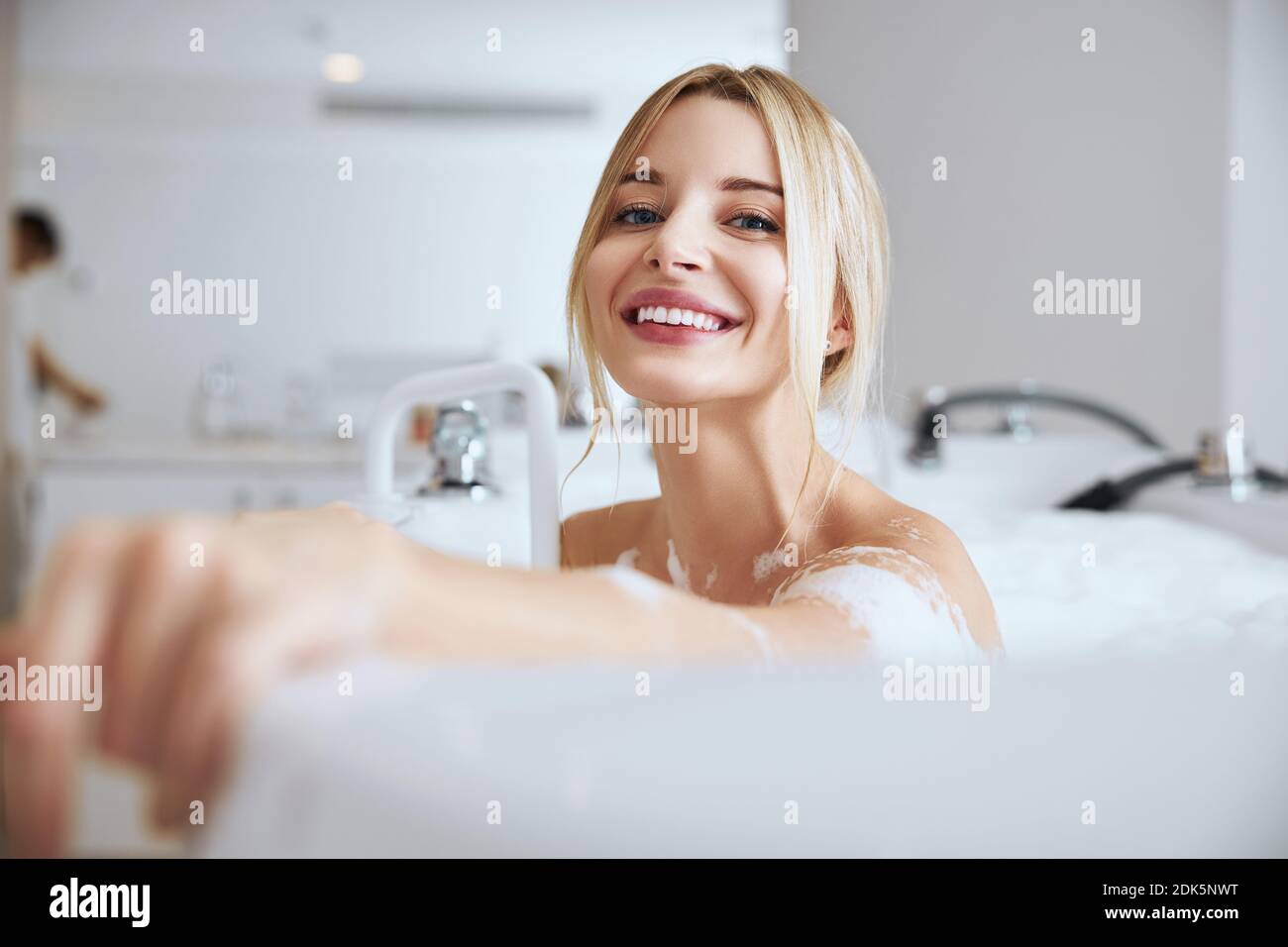 Young blonde woman in bathtub hi-res stock photography and images - Alamy