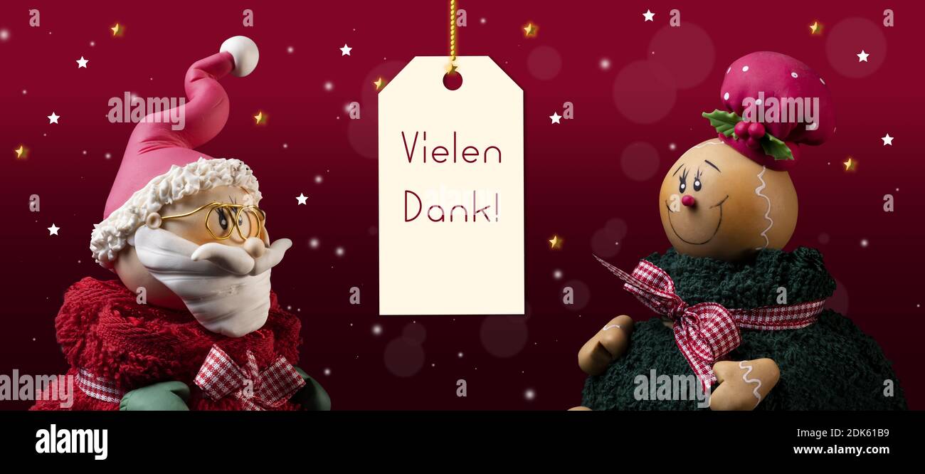 A closeup of an ornate Santa Clause and Gingerbread with the word 'Vielen' at the center- concept thanksgiving during Christmas season Stock Photo