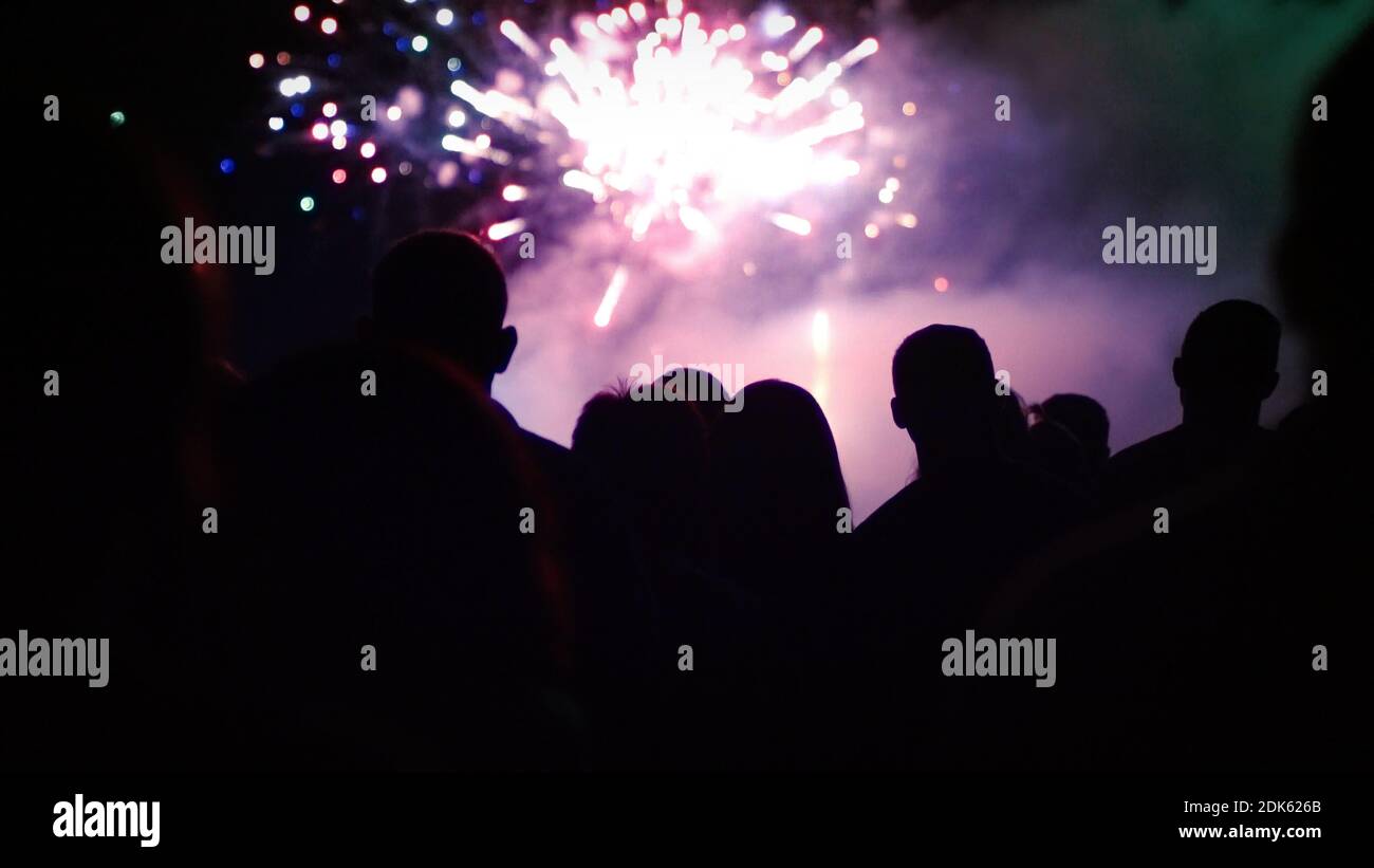 Crowd watching fireworks and celebrating new year eve Stock Photo - Alamy