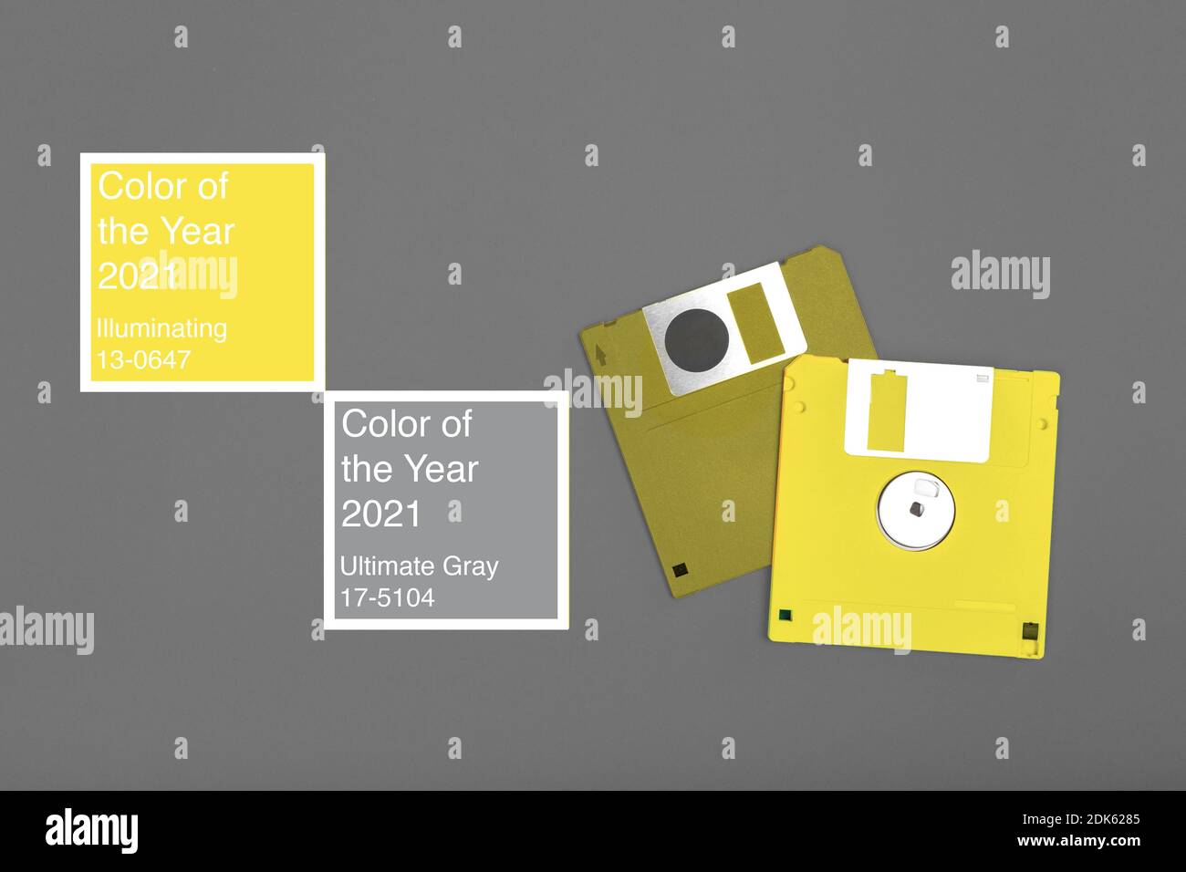 Two yellow computer floppy disks on gray Stock Photo