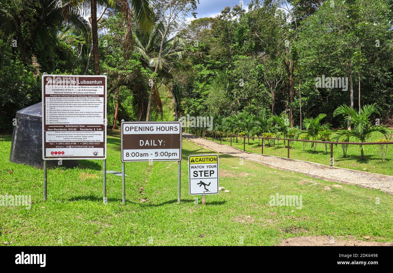 TOLEDO DISTRICT, BELIZE - Jun 10, 2019: Entry signs help inform visitors of policies while visiting Lubaantun Mayan Archaeological Site in Southern Be Stock Photo