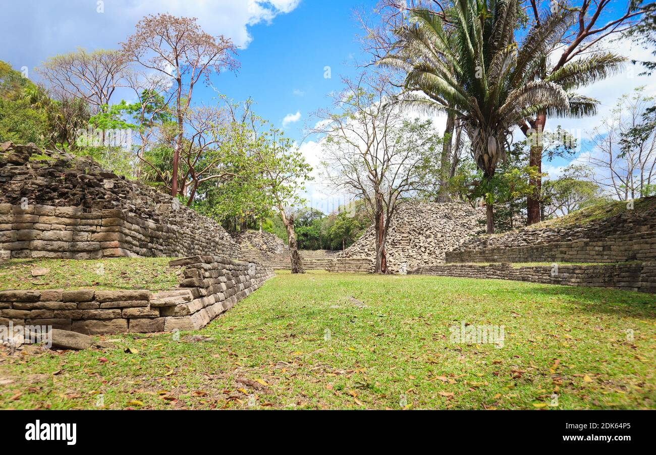 TOLEDO DISTRICT, BELIZE - Jun 10, 2019: A courtyard surrounded by structure ruins at Lubaantun Mayan Archaeological Site in Southern Belize. Stock Photo