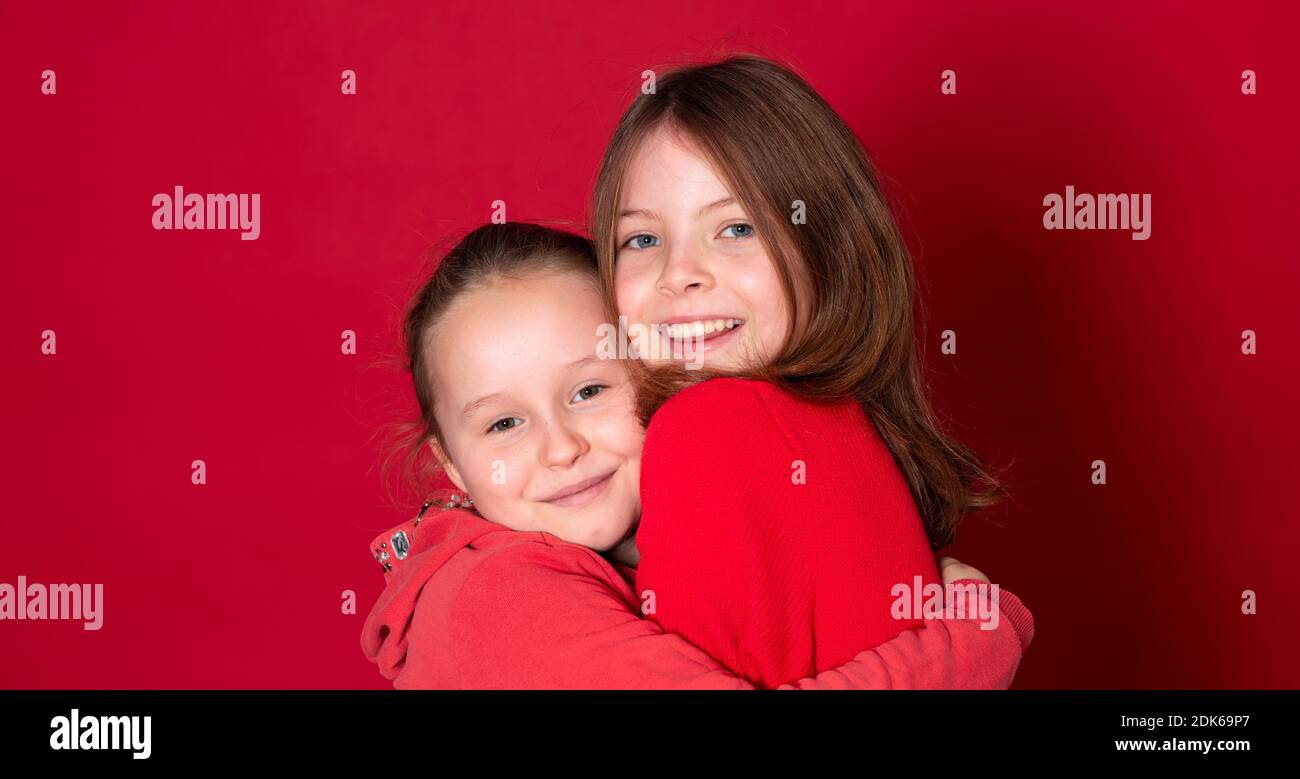 Best Girlfriends Wearing Red Clothes In Front Of Red Background Stock Best Girlfriends Wearing Red Clothes In Front Of Red Background Stock