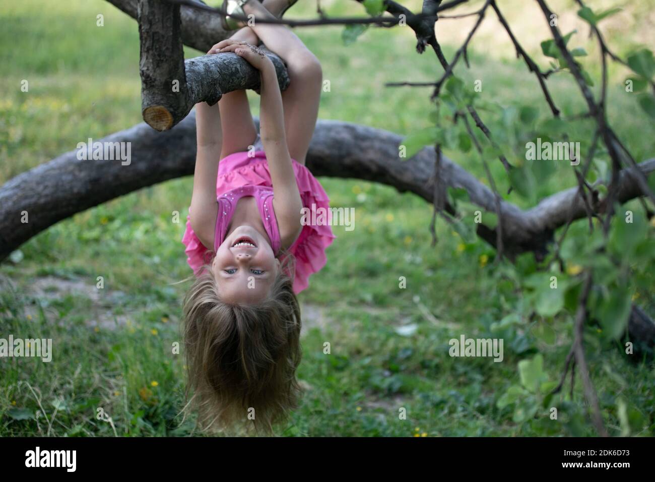 Girls hanging upside down on hi-res stock photography and images - Alamy