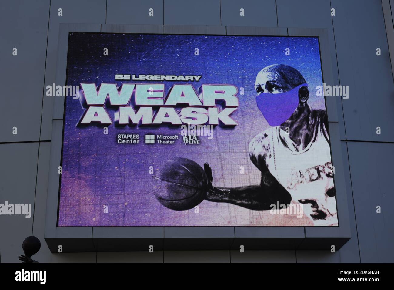 A 'Wear a mask' public service announcement with image of Los Angeles Lakers former player Magic Johnson at the Staples Center, Monday, Dec. 14, 2020, Stock Photo