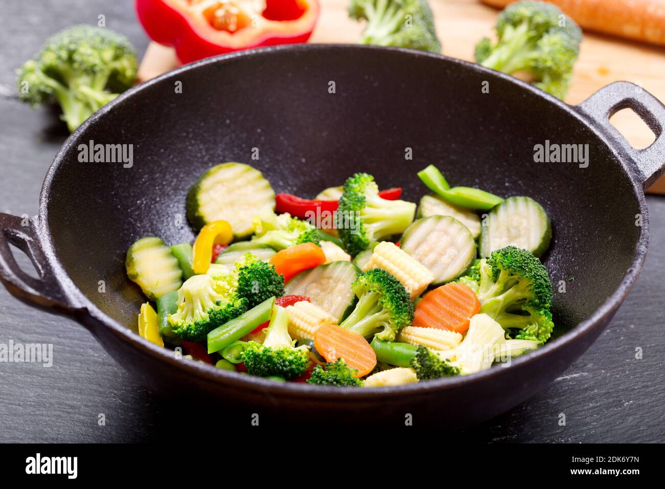 stir fried vegetables in a wok on dark table Stock Photo Alamy