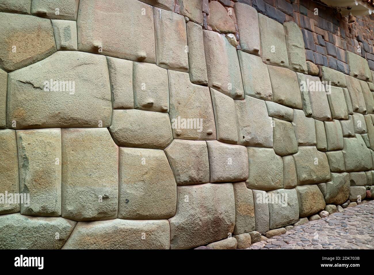 Amazing Stonework of the Inca Wall on Hatun Rumiyoc Street, the Ancient Street in Historic Centre of Cusco, Peru, South America Stock Photo