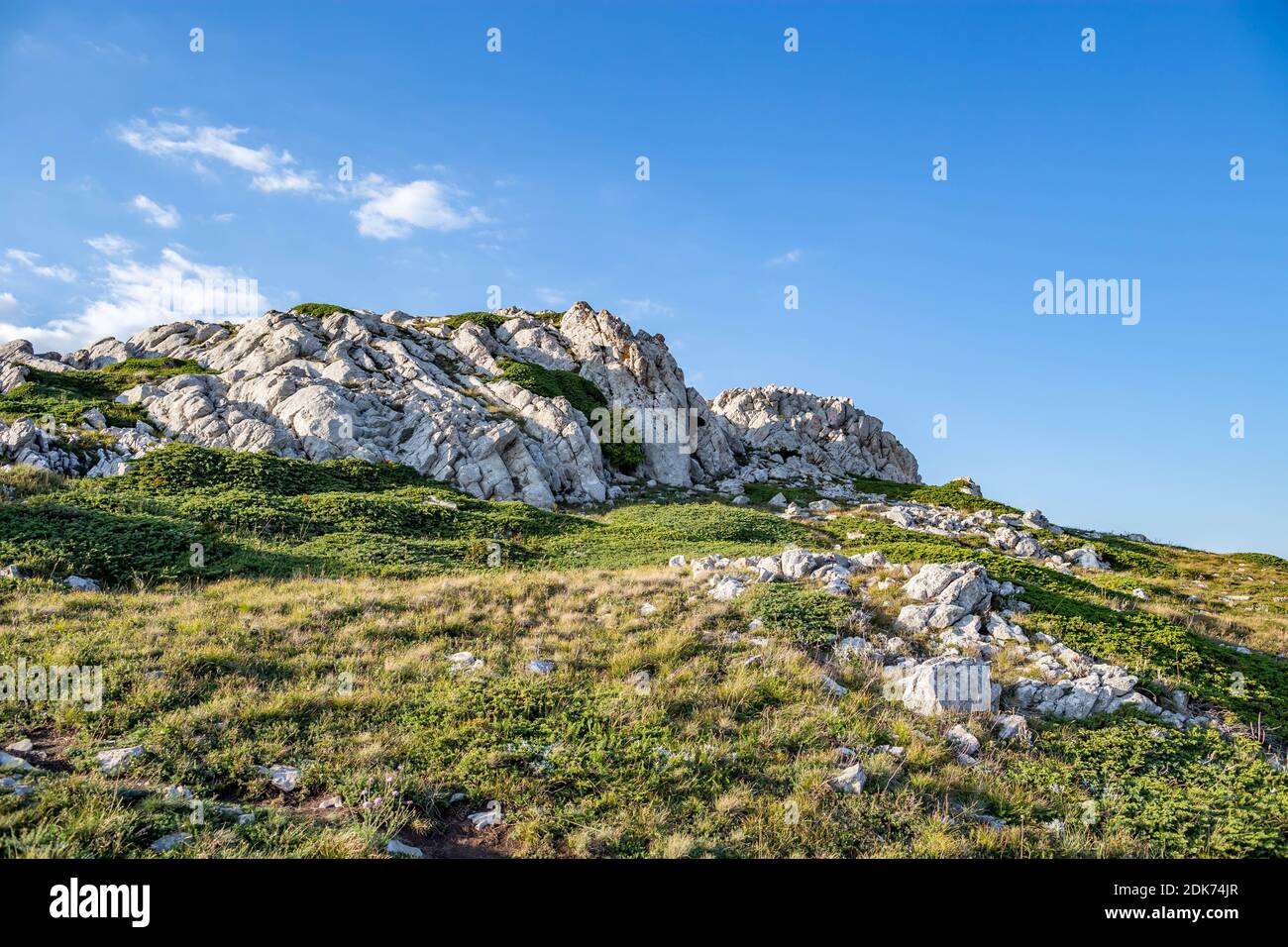 Rock Formations On Landscape Against Blue Sky Stock Photo