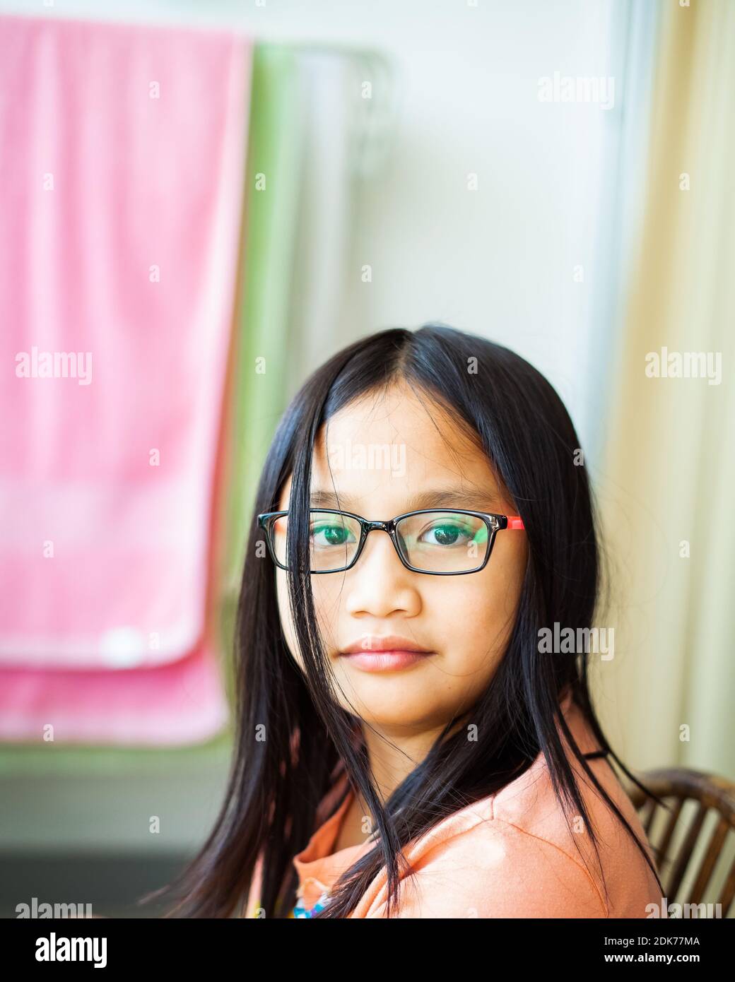 Portrait Of Young Little Asian Girl Age 9 Wearing Glasses Years Old In  Natural Light At Home Stock Photo - Alamy