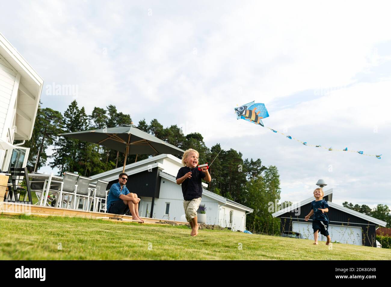 Children flying kite Stock Photo