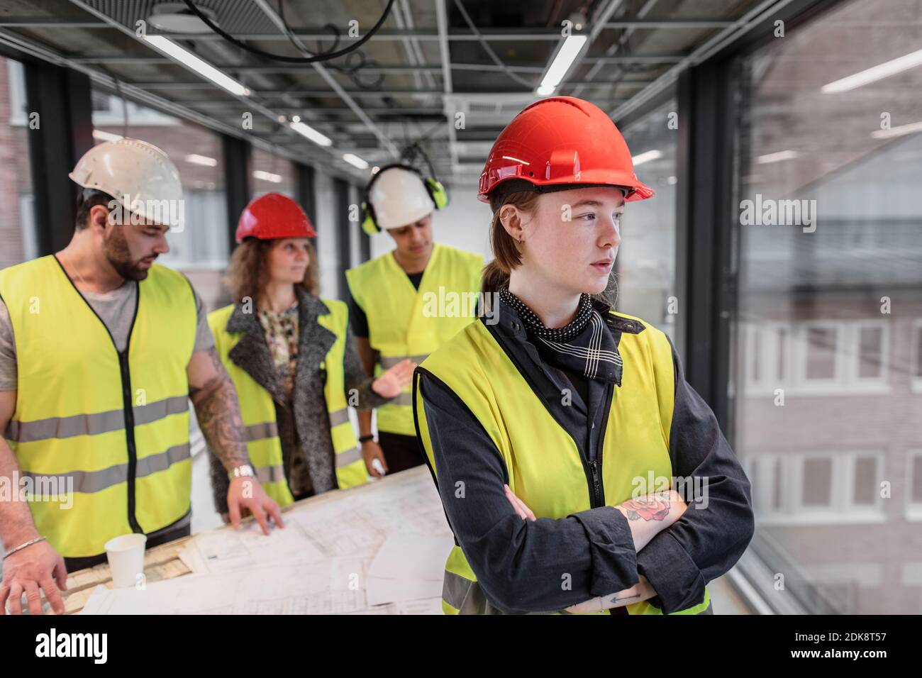 Female worker wearing hardhat Stock Photo