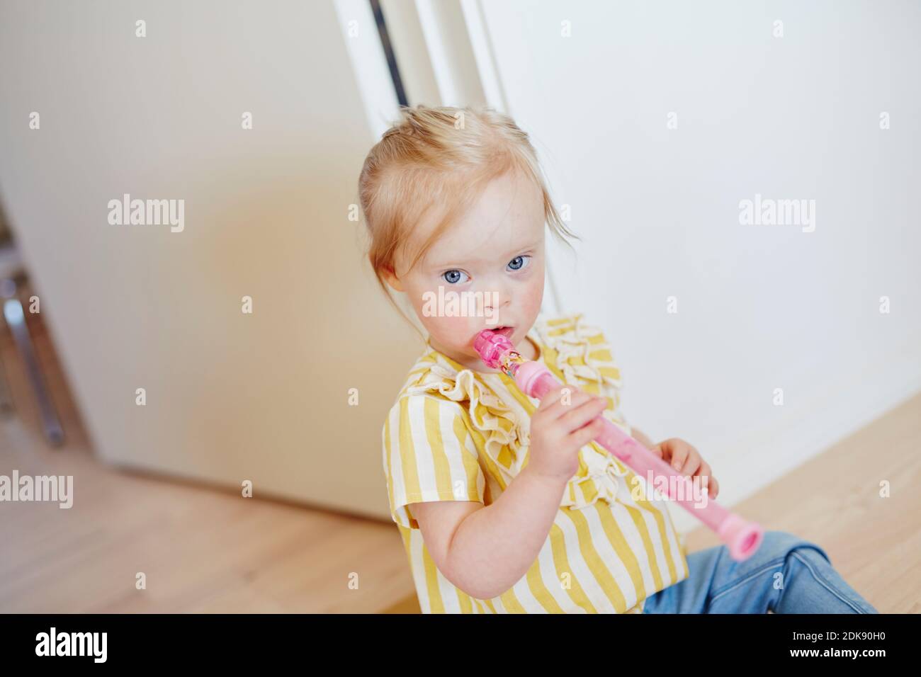 Girl holding flute Stock Photo Alamy