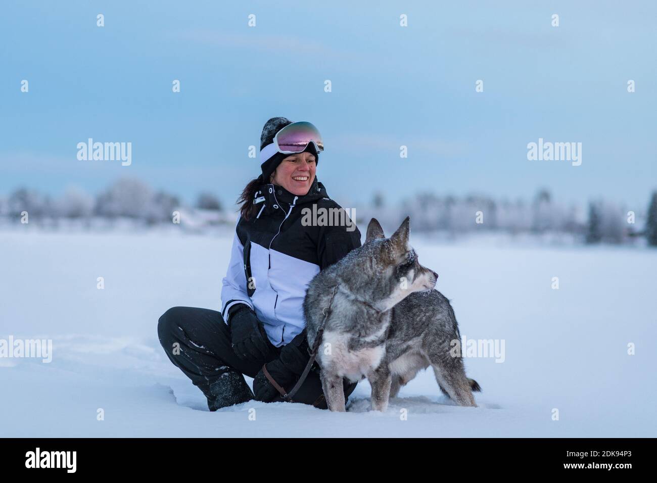 Woman with dog at winter Stock Photo