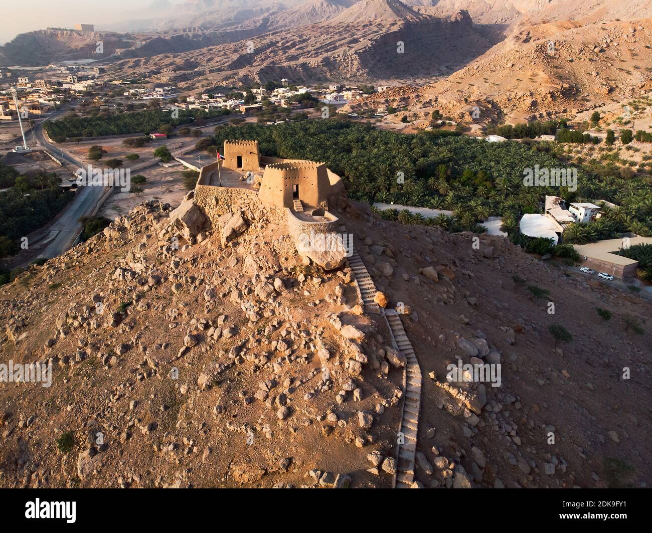 Dhayah Fort rock fortress in Ras al Khaimah emirate of the United Arab Emirates aerial view at sunset Stock Photo