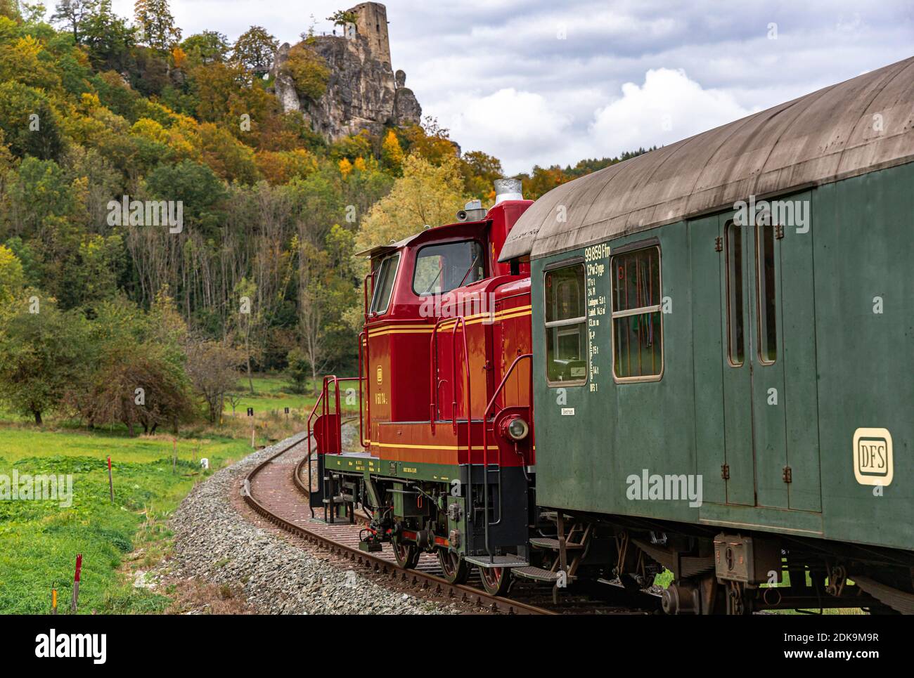 Historic railway with diesel locomotive in Wiesenttal below the Neideck ruin, Streitberg, Upper Franconia, Bavaria, Germany Stock Photo