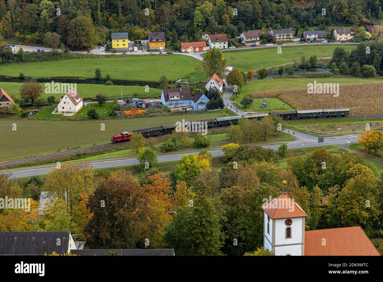 Historic railway with diesel locomotive drives through Streitberg in autumn, Upper Franconia, Bavaria, Germany Stock Photo