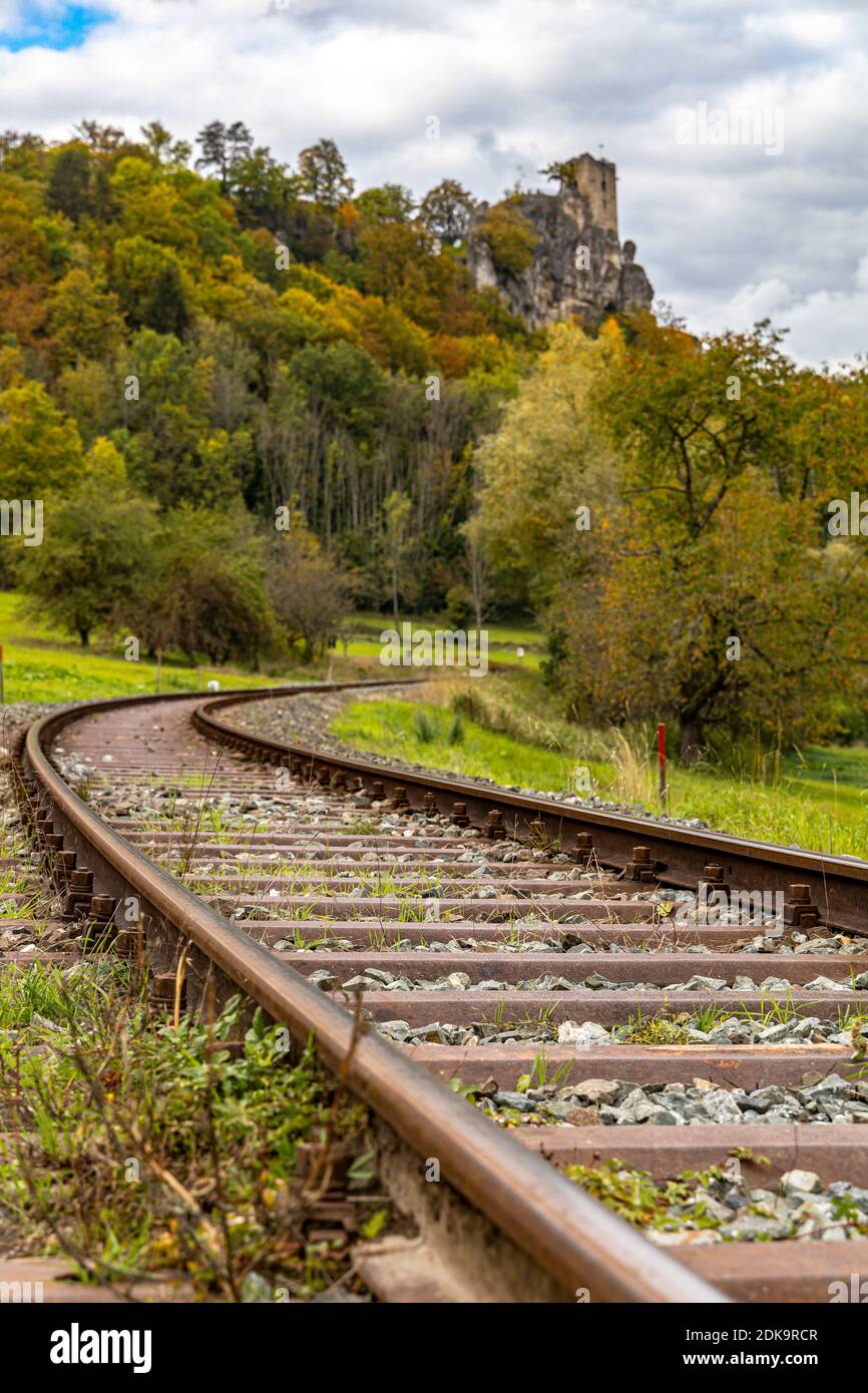 Railway track below the Neideck ruin in autumn, Streitberg, Upper Franconia, Bavaria, Germany Stock Photo