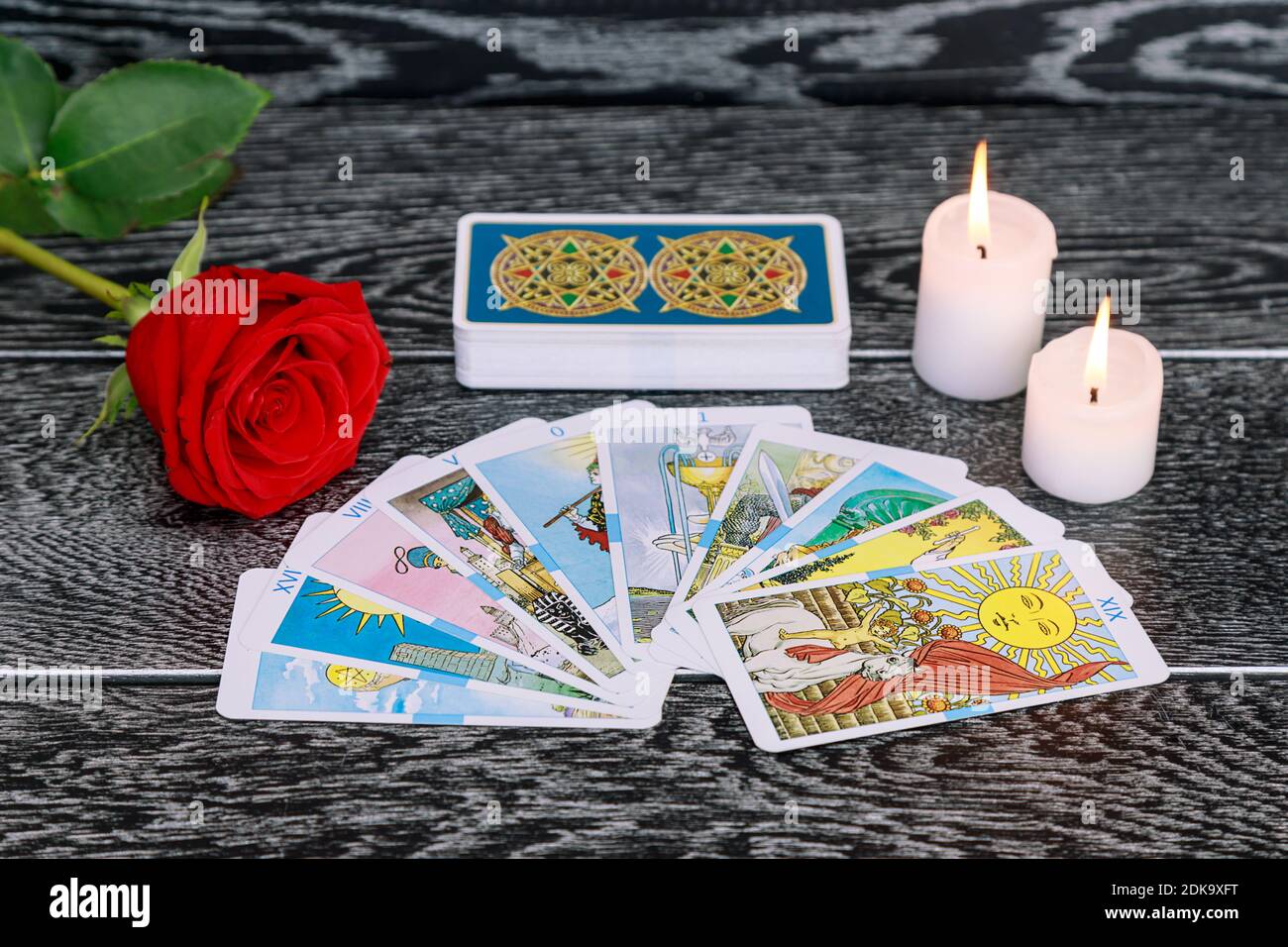 High Angle View Of Tarot Cards With Candles And Rose On Table Stock Photo -  Alamy