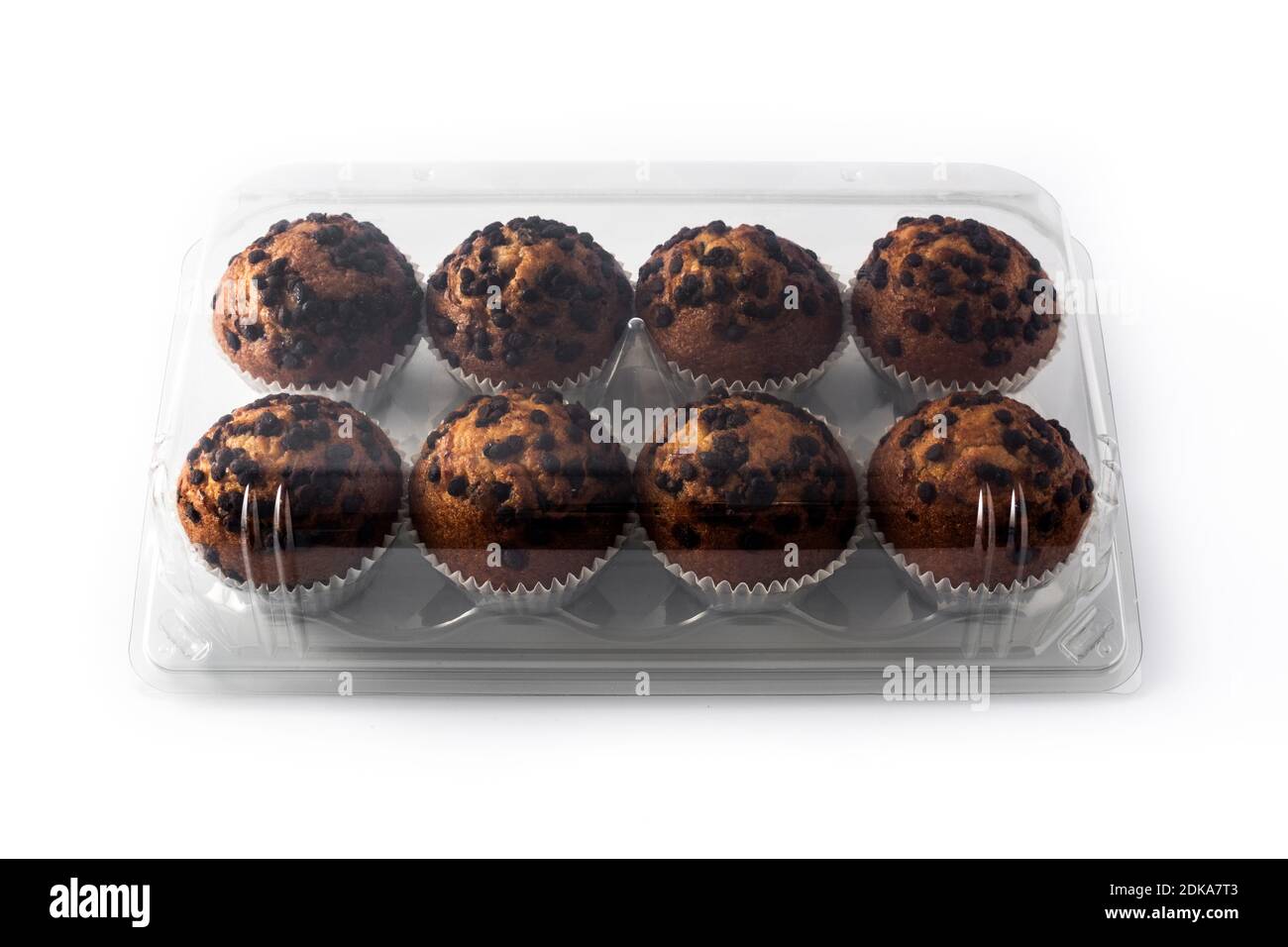 Just baked chocolate muffins packaged isolated on white background