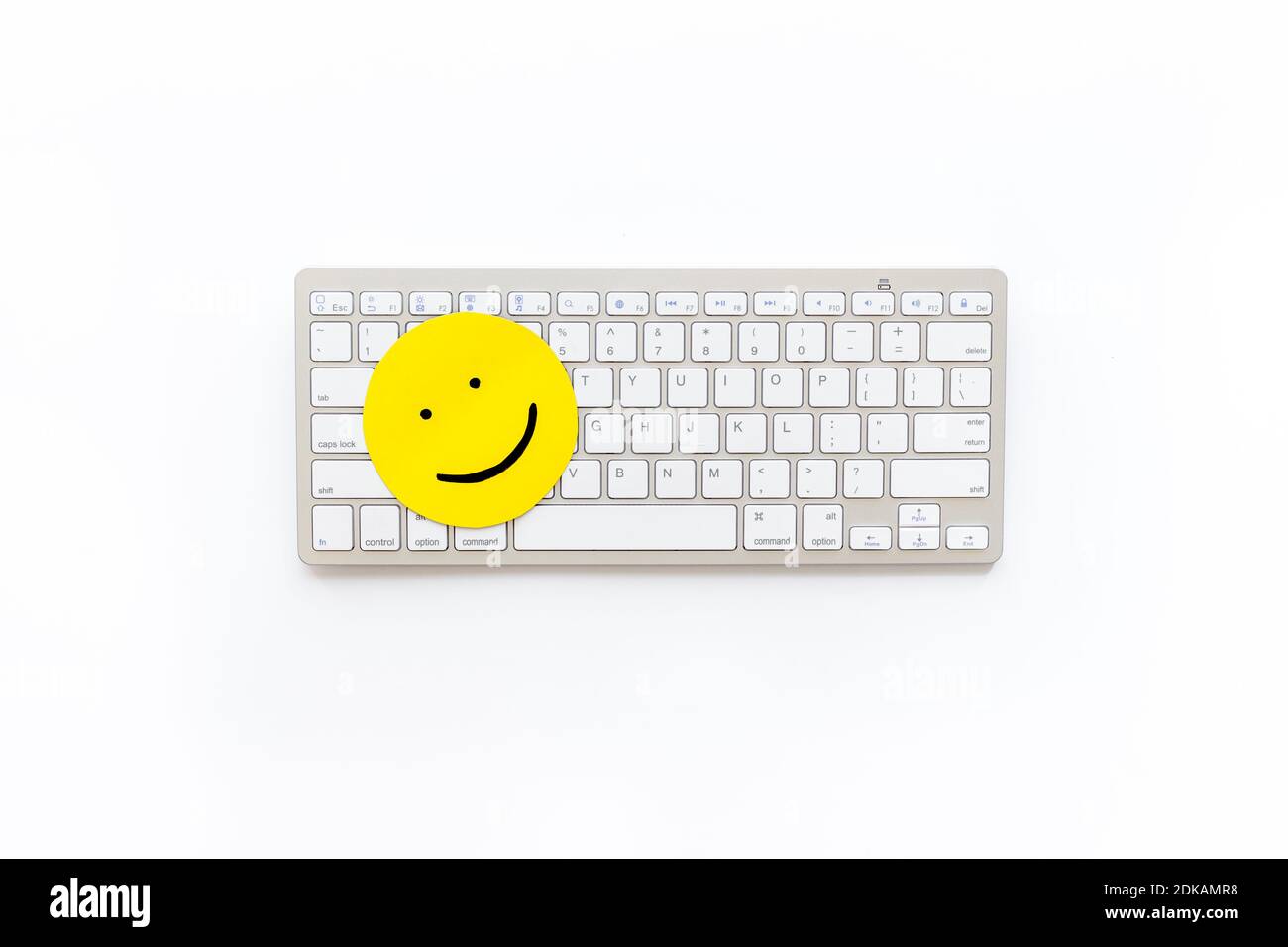 Happy face emotion concept. Happy face on the keyboard, top view Stock