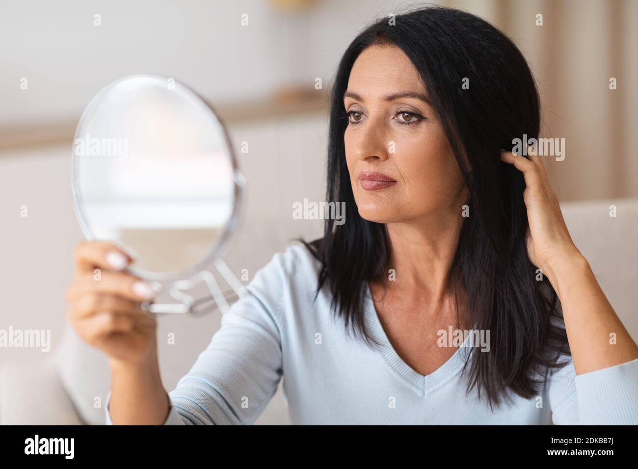 Woman mature face skin mirror hi-res stock photography and images - Alamy