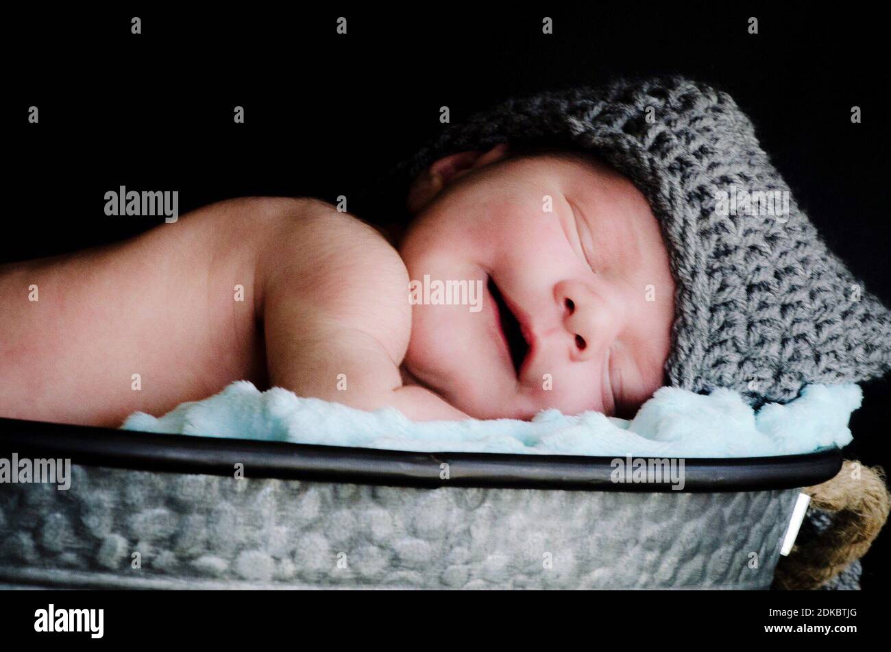 Baby In Moses Basket High Resolution Stock Photography and Images Alamy