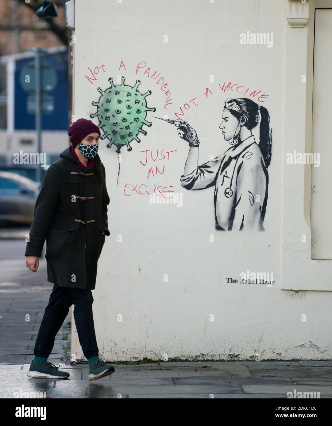 Edinburgh, Scotland, UK. 15 December 2020. Street art of Covid-19 vaccination by street artist  The Rebel Bear in Edinburgh is vandalised by anti vaccination protestor. Iain Masterton/Alamy Live News Stock Photo