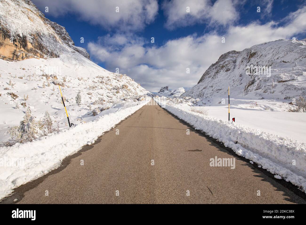 the straight road of the valparola pass, snowy landscape with mount averau in the background, dolomites, cortina d'ampezzo, belluno, veneto, italy Stock Photo