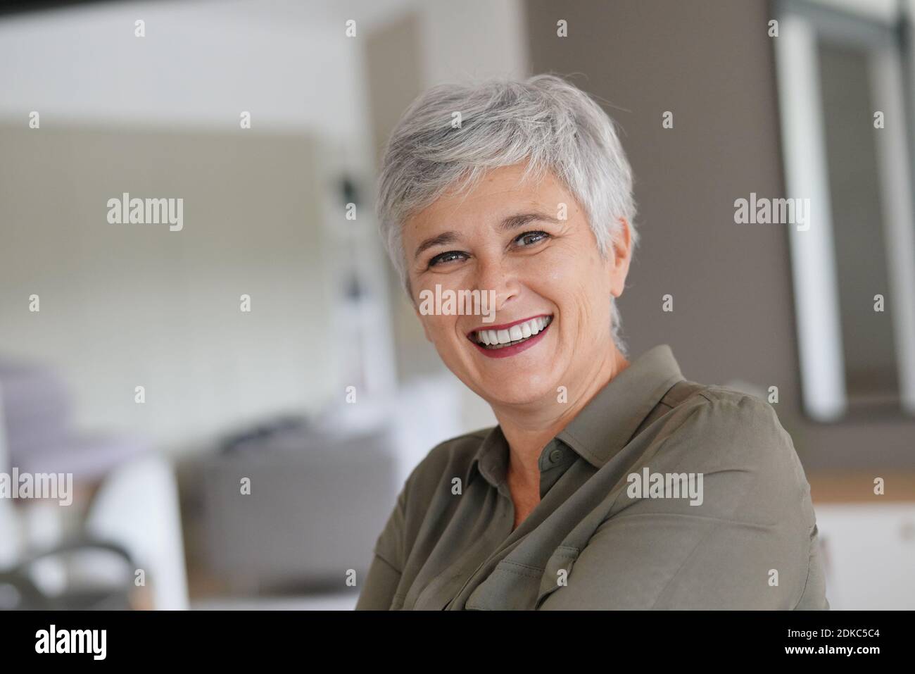 Portrait of a attractive mature woman with white hair Stock Photo - Alamy