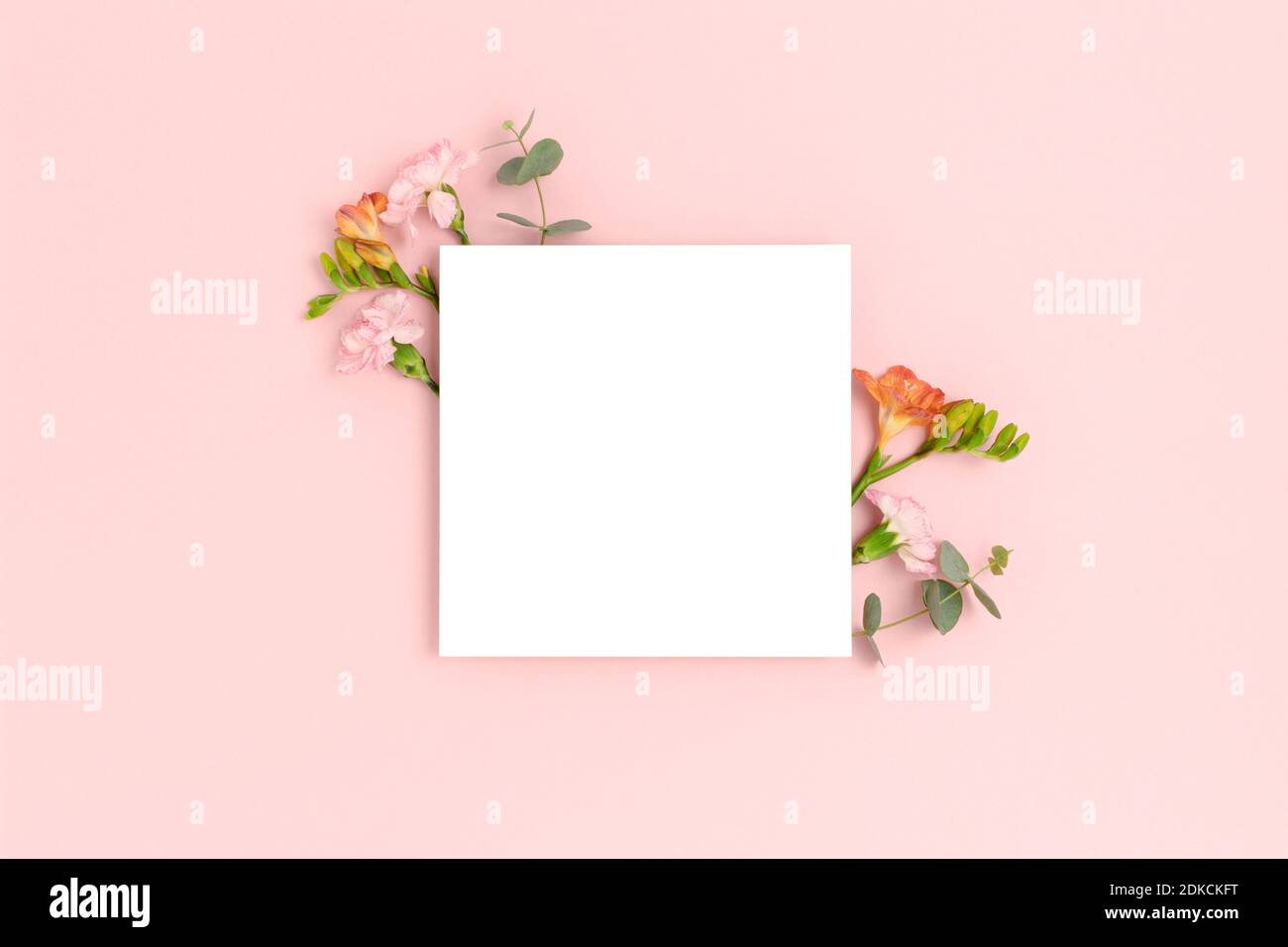 Blank paper card mockup with frame made of flowers and eucalyptus ...