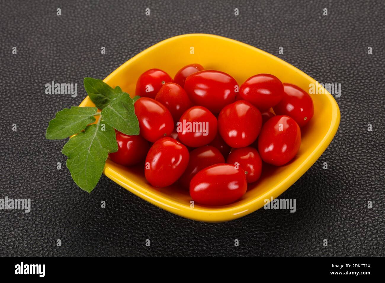 Sweet Red cherry tomatoes in the bowl Stock Photo - Alamy