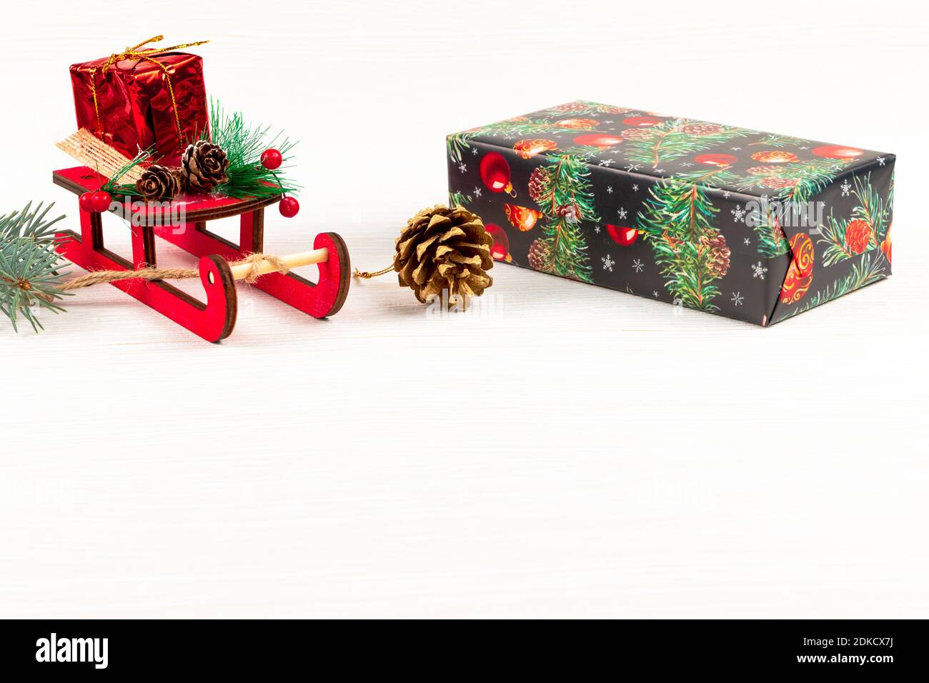 Christmas cone, box with a gift, Santa Claus sleigh and a branch of ...