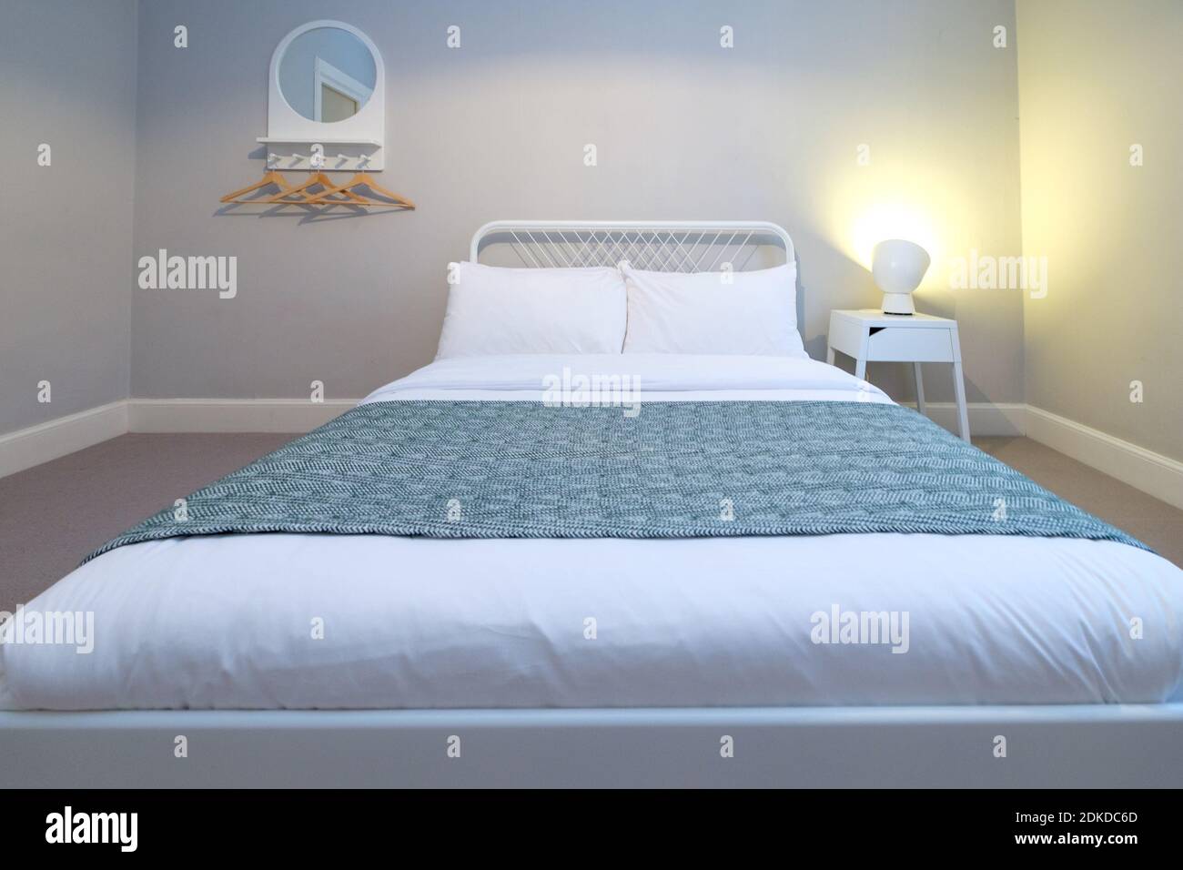 Arranged Bed Against Wall In Bedroom At Home Stock Photo Alamy