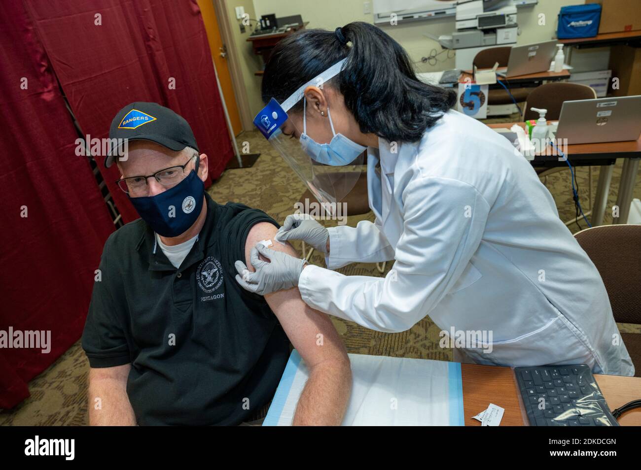 Bethesda, United States. 14th Dec, 2020. U.S. Acting Defense Secretary Chris Miller receives one of the first Pfizer COVID-19 vaccinations at Walter Reed National Military Medical Center December 14, 2020 in Bethesda, Maryland. Credit: Lisa Ferdinando/DOD/Alamy Live News Stock Photo