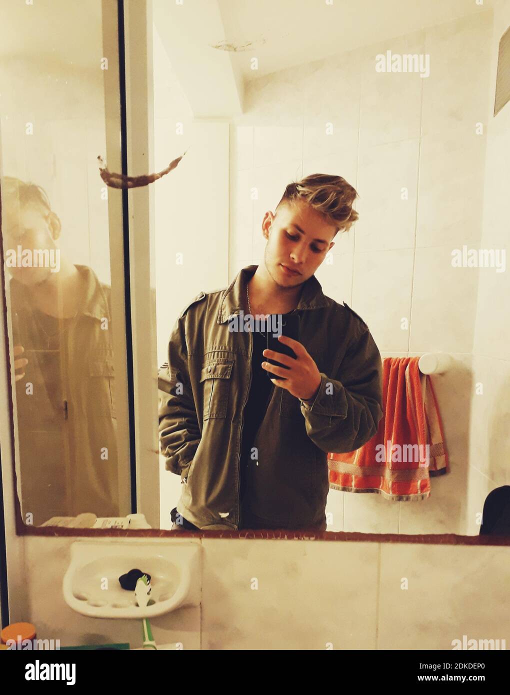 Teenager mobile phone bathroom hi-res stock photography and images - Alamy