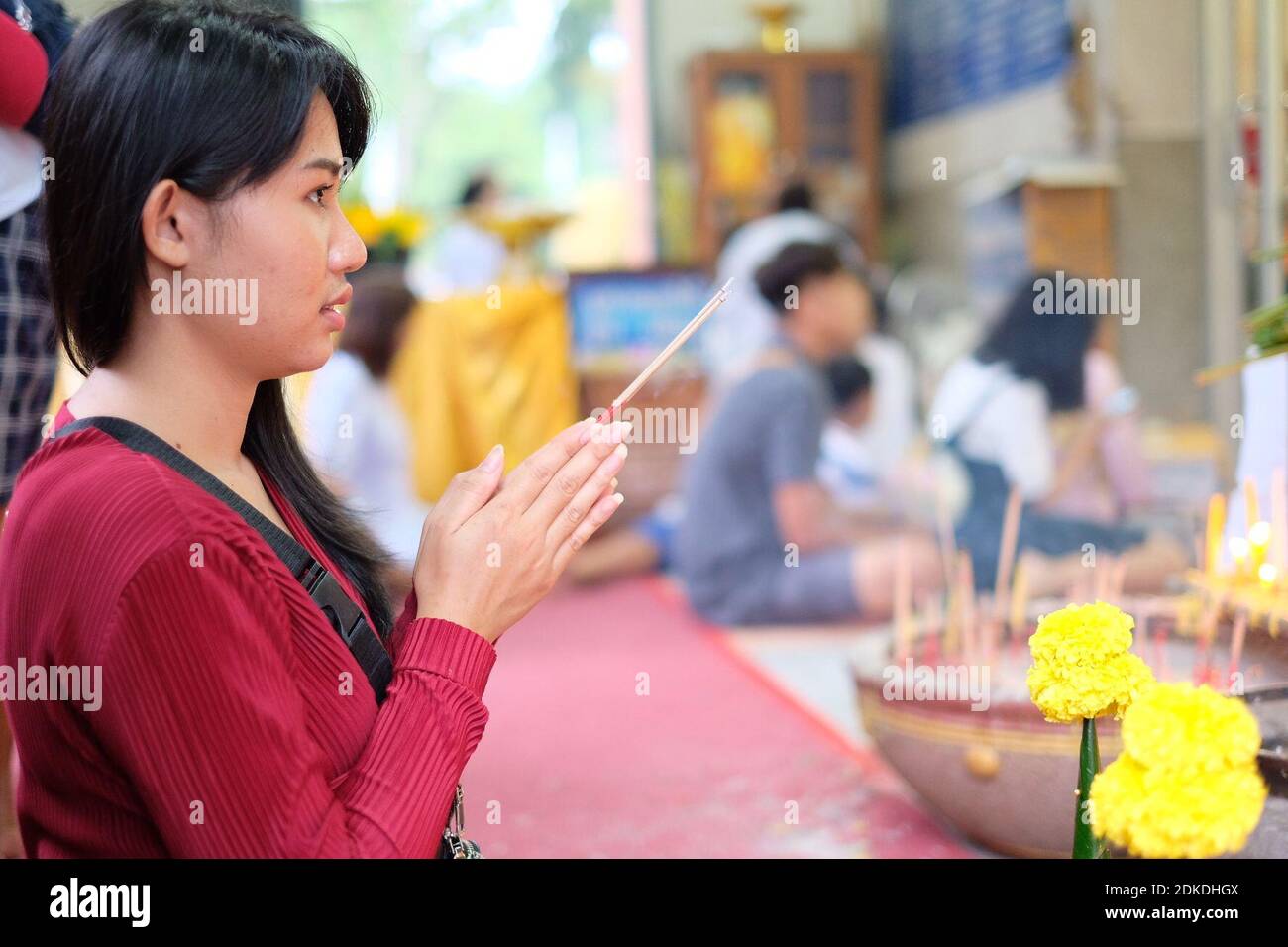 Young woman holding incense sticks hi-res stock photography and images ...