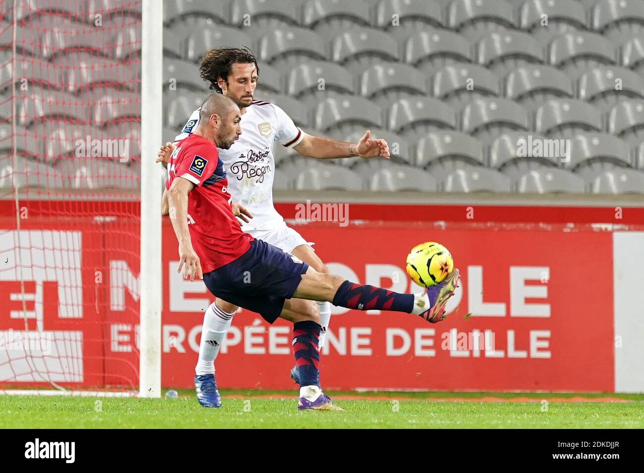 Burak Yilmaz Of Lille Osc Is Challenged By Paul Baysse Of Girondins Bordeaux During The League