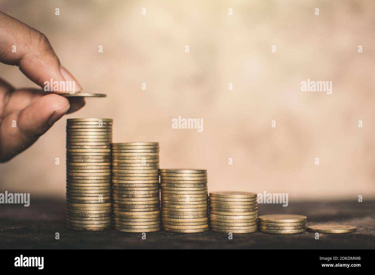 Cropped Image Of Businessman Stacking Coins Stock Photo