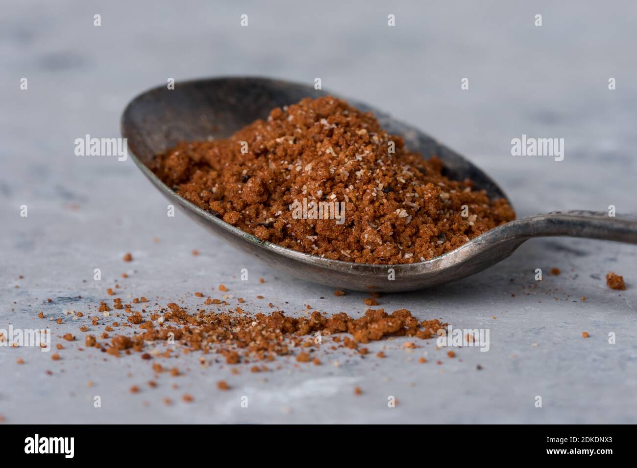 Close-up Of Spice In Spoon On Table Stock Photo