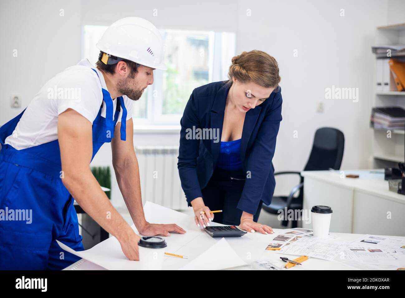 Two architects working on a project in the office. Stock Photo