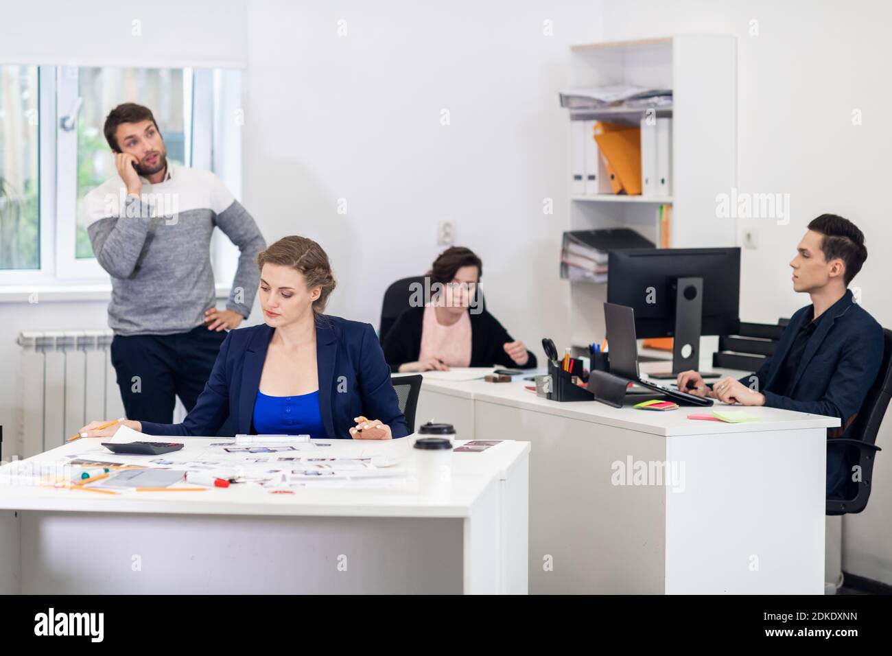 Office workers busy with their tasks, daily office routine Stock Photo