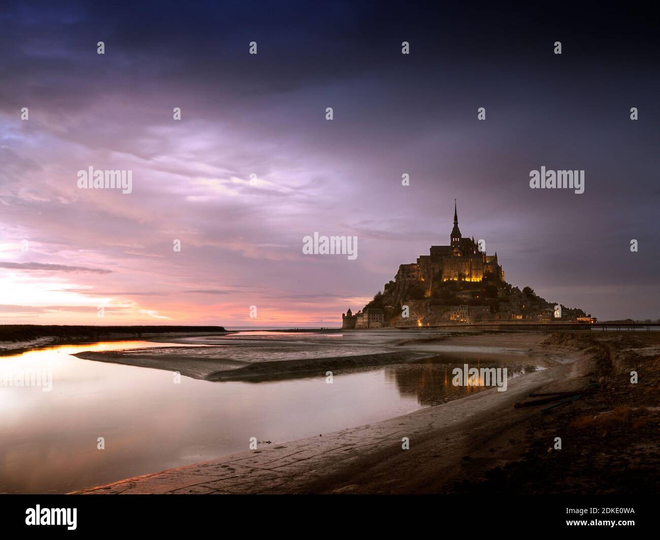 Le Mont-Saint-Michel at sunset and low tide Stock Photo
