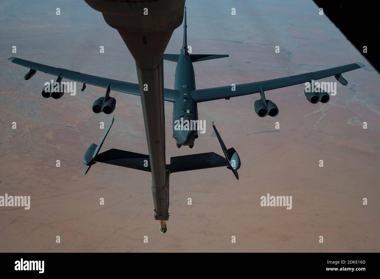A U.S. Air Force B-52 Stratofortress strategic bomber aircraft from the 2nd Bomb Wing, positions for refueling inflight from a KC-135 Stratotanker aircraft during a multi-day Bomber Task Force mission December 10, 2020 over Qatar. The bomber was relocated to the region following an increase in tensions with Iran. Stock Photo