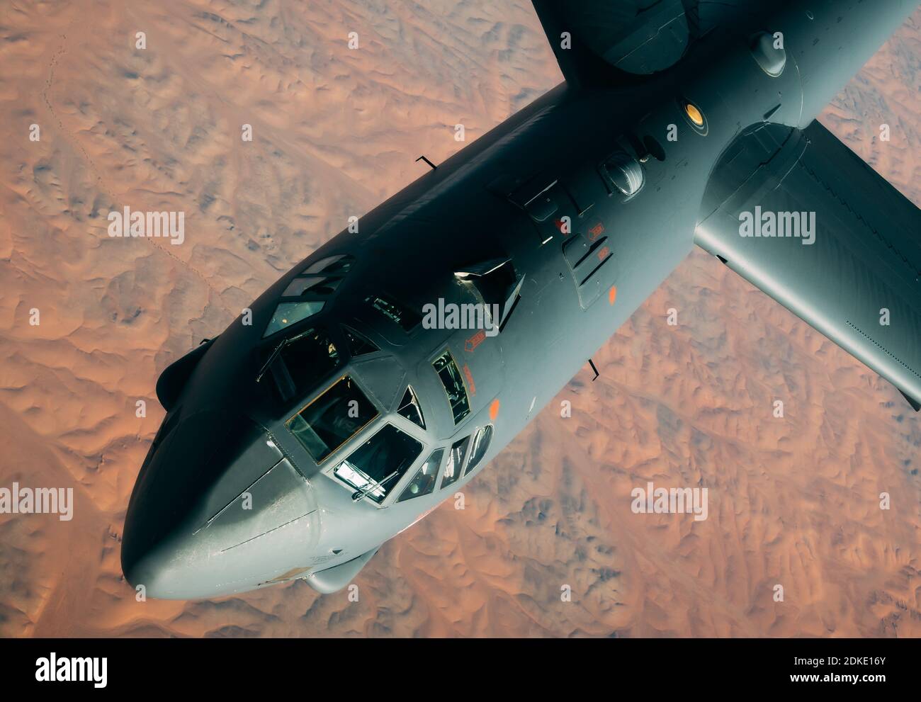 A U.S. Air Force B-52 Stratofortress strategic bomber aircraft from the 2nd Bomb Wing, breaks loose after being refueled inflight from a KC-135 Stratotanker aircraft during a multi-day Bomber Task Force mission December 10, 2020 over Qatar. The bomber was relocated to the region following an increase in tensions with Iran. Stock Photo